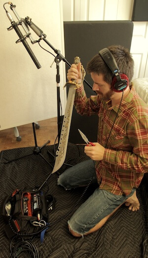 Michael O'Connor recording sword foley for the short film “Spirit Town” (image: PSE Blog).