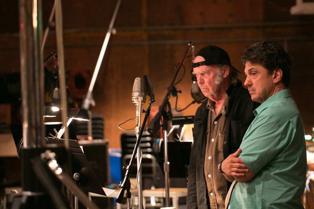 Neil Young and producer Niko Bolas, in the studio recording Young’s vocals for the new LP Storytone. 
