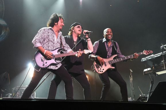 From left: Toto rock band members Steve Lukather, Joseph Williams and Nathan East perform live during their 35th anniversary tour at the Nippon Budokan in Tokyo 2014 (image: ©Jun Sato).